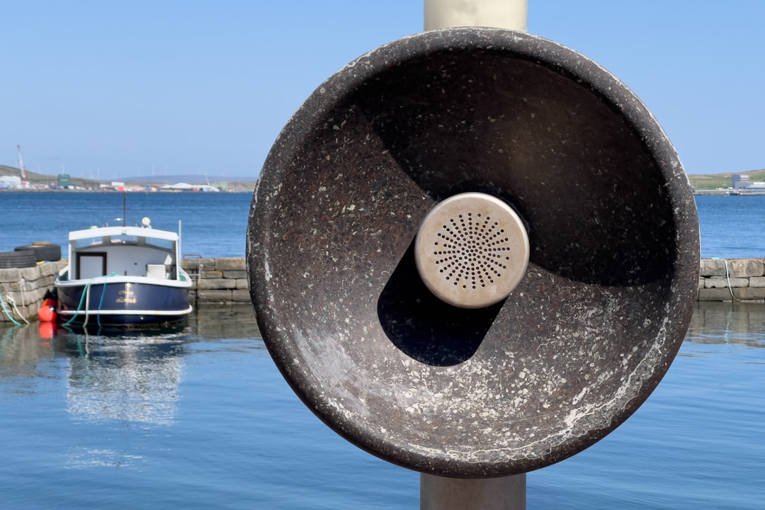 A large metal object sitting in the middle of a body of water